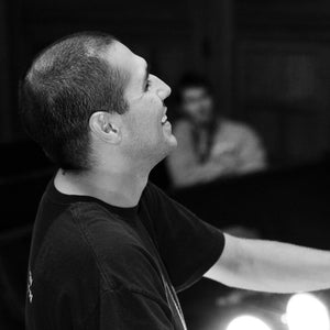 Theatre director and teacher Robert Botello smiles during a rehearsal