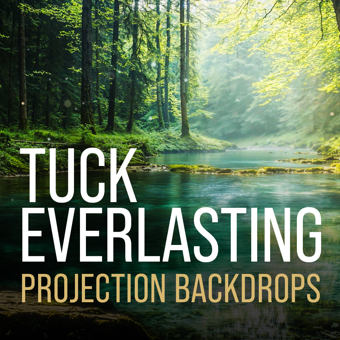 Digital projection backdrop for Tuck Everlasting featuring a serene forest stream, dappled sunlight, and lush green woodland scenery for theatre productions.