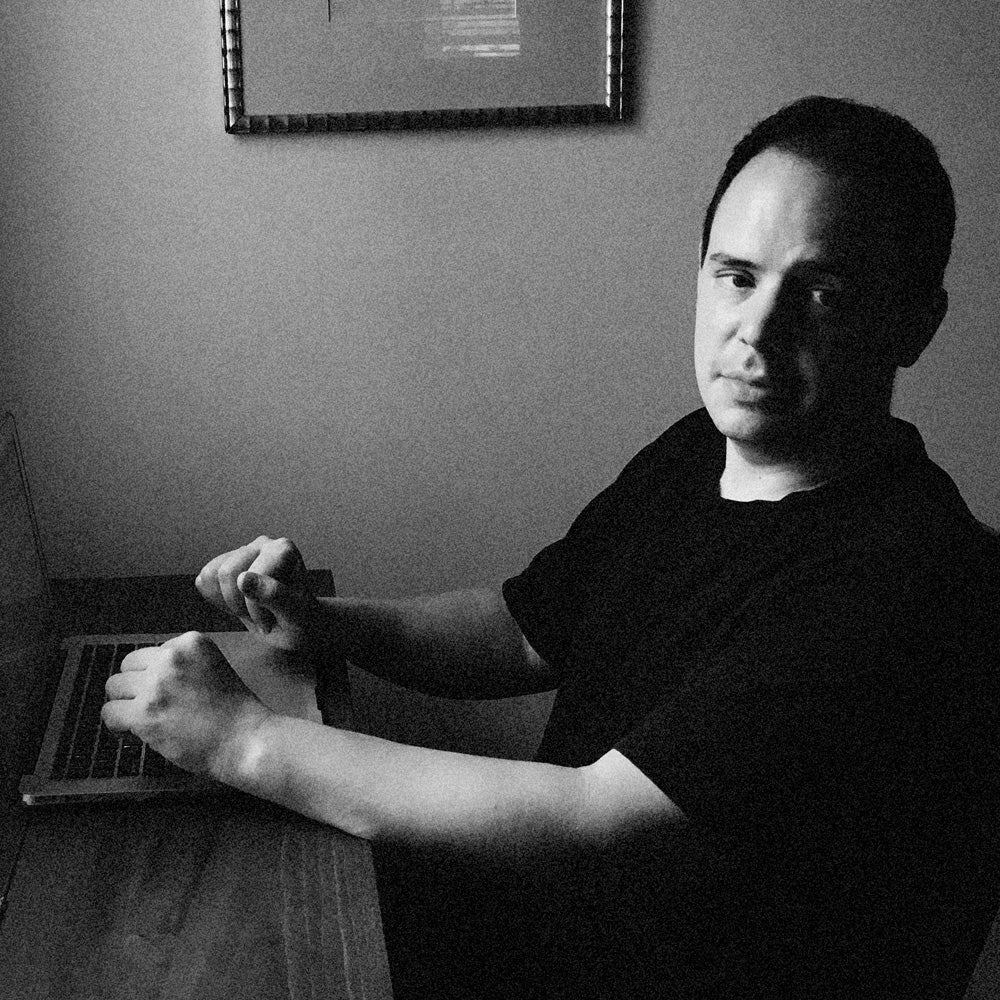 Playwright and Stage Partners co-founder Jason Pizzarello at his keyboard