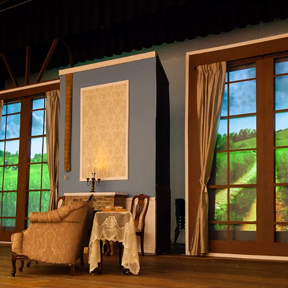 Pride and Prejudice high school performance with theatre projection backdrops