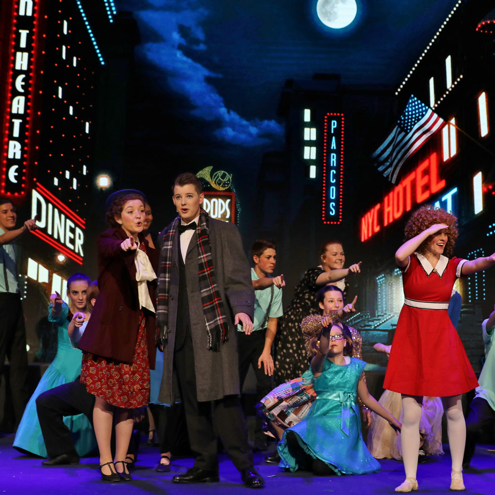 Stage rehearsal of Annie using digital projection backdrops by Theatre Avenue