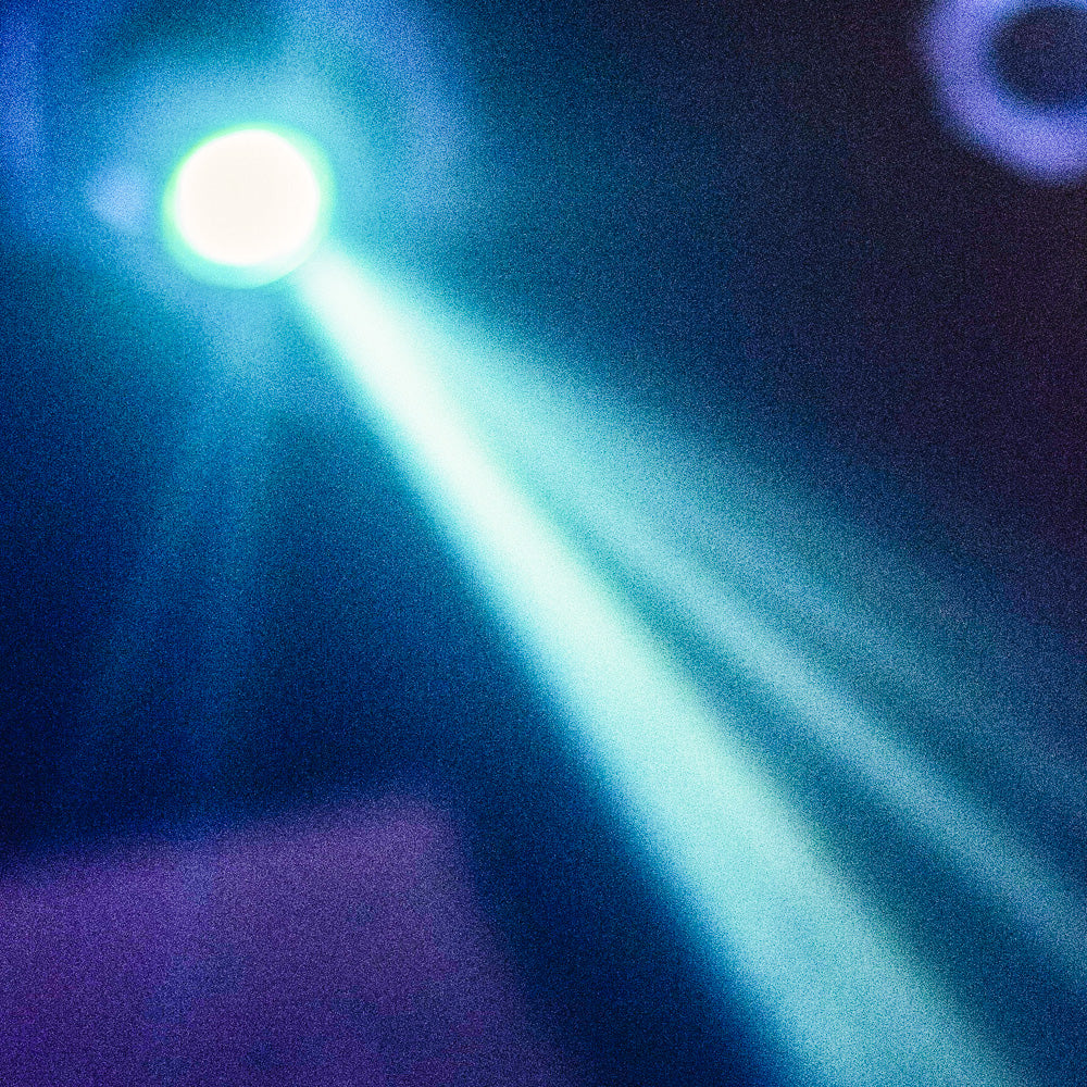 Theatrical light shining down onto the stage