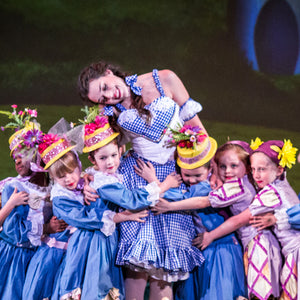Dorothy played by Avery McGee, with her munchkin friends, at the Savannah Ballet